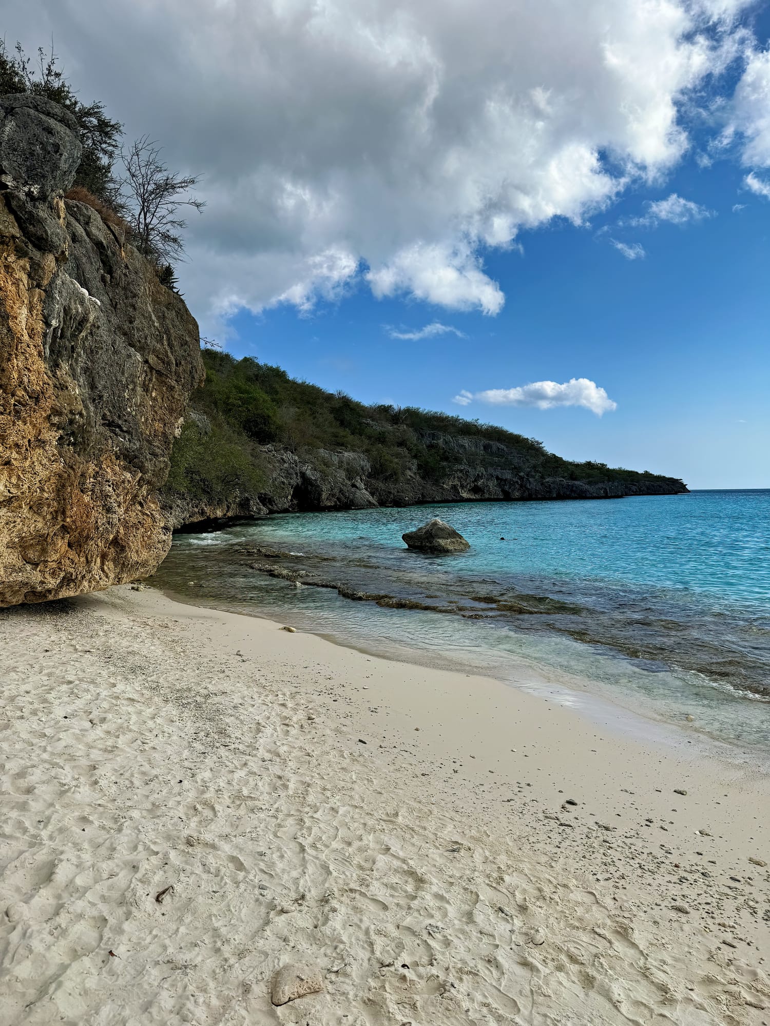 Secluded white sand beach in St. Maarten, Happy Bay Beach.